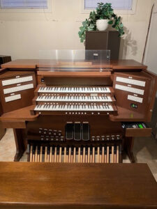 The Allen Organ Protege Series AP-12 is a three manual Lumitech™ tab console with a complete 46 stop specification including super and sub swell couplers, an alternate baroque stop list, three sets of Celeste’s and a commanding Festival Trumpet. To complete the versatility of this instrument, a Vista MIDI module was installed eight years ago. This module adds 227 MIDI and organ stops, record and playback features, and serves as a MIDI router where you can add another MIDI module and control it from the Vista interface. This organ was purchased in 1998 and was recently upgraded when the church received a memorial gift for a new organ. The instrument is in like new condition, and is offered with a 90-day Warranty on parts and labor. Call us to see, hear, and play this wonderful instrument.